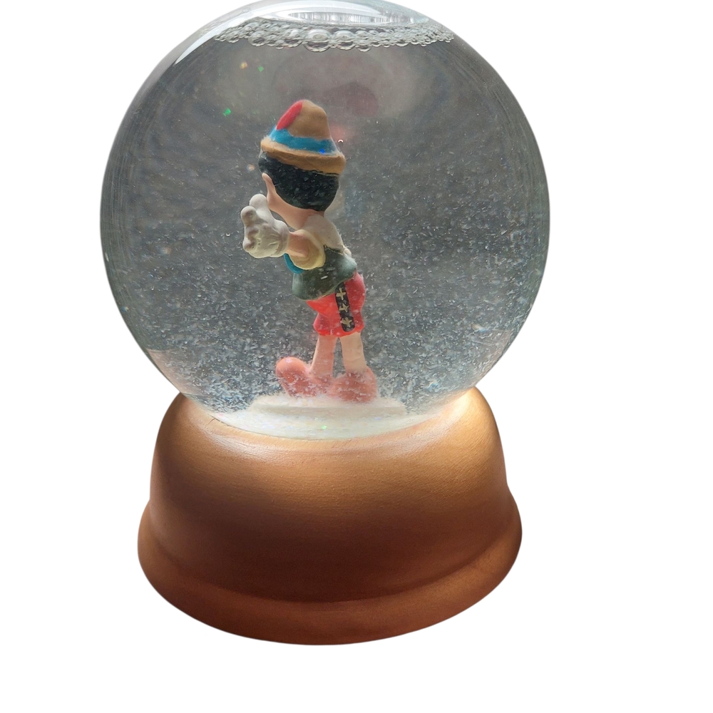Pinocchio Snow Globe with Brown Base